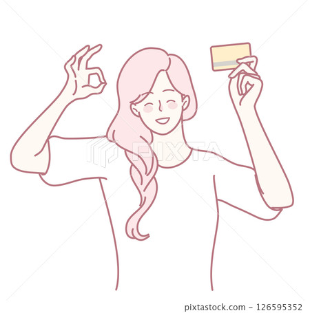 A delighted woman is joyfully holding her credit card, radiating positivity and style 126595352