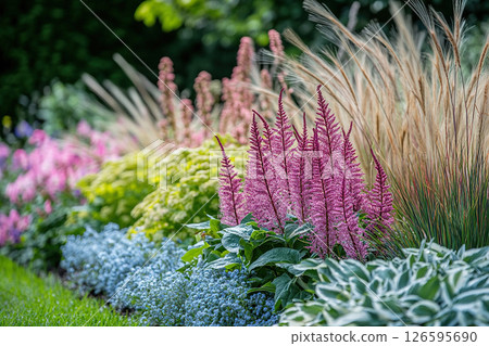 A bright flowerbed with lush foliage A bright flowerbed with lush foliage 126595690