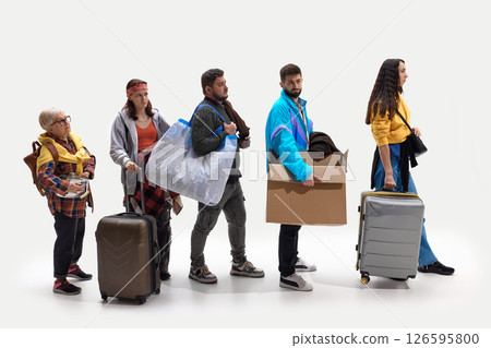 People stand in line with luggage and personal stuff, bored and frustrated against white studio background. People stand in line with luggage and personal stuff, bored and frustrated against white studio background. 126595800