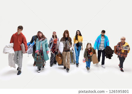 Group walks slowly carrying bags and household items. People looking exhausted and displaced against white backdrop 126595801