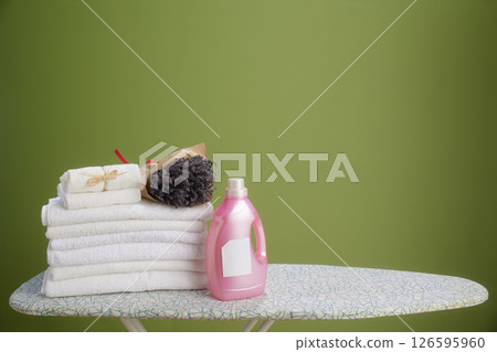 Lavender and fresh towels on ironing board 126595960