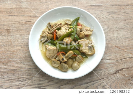 stir fried green pea and straw mushroom with pork in soybean sauce on plate 126598232