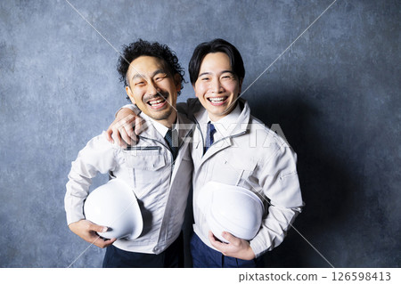 Two men in work clothes 126598413