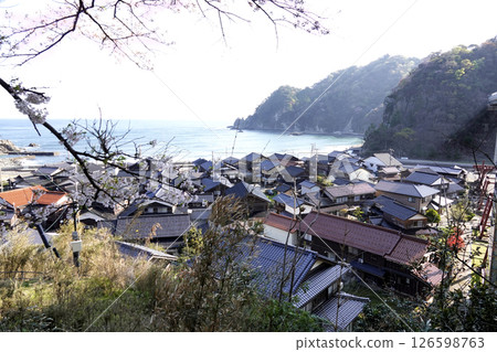 The Sea of Japan and villages as seen from the sidewalk at Amarube-Sora Station 126598763