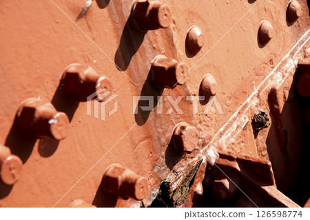 Old Amarube Bridge: Corroded steel members, rivets, and bolts in the pier 126598774