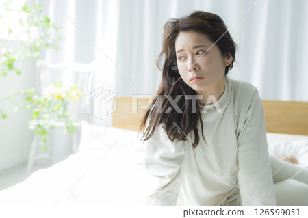 A woman lying on the bed 126599051