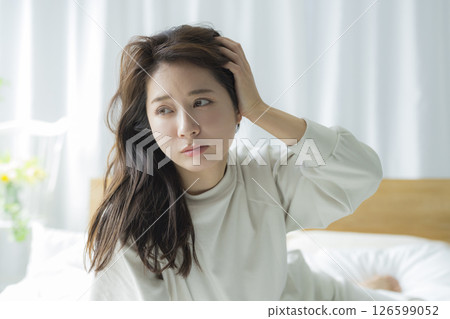 A woman lying on the bed 126599052