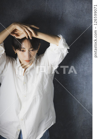 A woman with a white shirt A woman with a white shirt 126599071