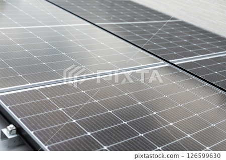 Image of solar panels installed on the roof of a house (stock photo) 126599630