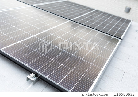 Image of solar panels installed on the roof of a house (stock photo) 126599632