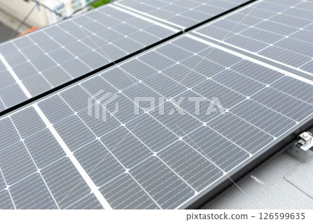 Image of solar panels installed on the roof of a house (stock photo) 126599635