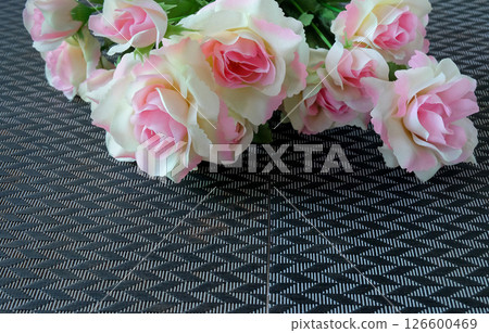 Pink rose flowers in a floral arrangement on background. Pink rose flowers in a floral arrangement on background. 126600469