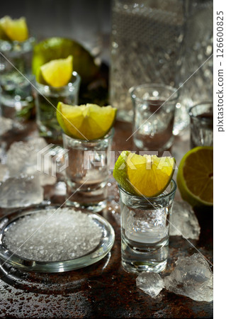 Tequila with lime, sea salt, and crushed ice. 126600825