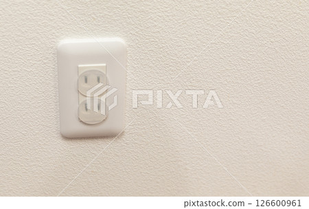 Guard attached to an outlet (stock photo) 126600961