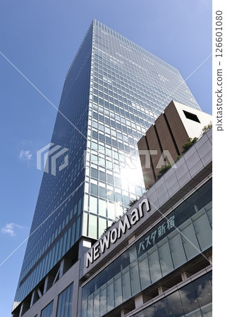 Shinjuku skyscrapers NEWoMan and Shinjuku Expressway Bus Terminal exterior (blue sky background) 126601080