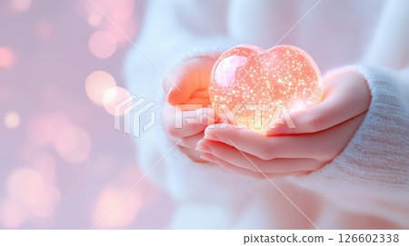 Hands Holding Glowing Heart in Soft Pink Light Emotional Connection and Tender Care Concept 126602338