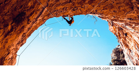 Man is climbing, training in the mountains. Man is climbing, training in the mountains. 126603428
