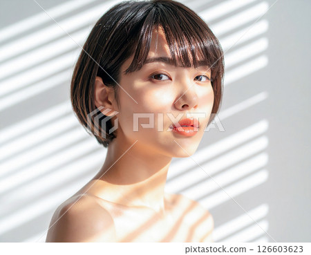 Woman by the window, bob cut 126603623