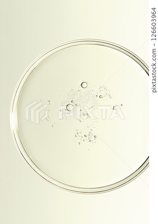 The texture of a cosmetic serum or body gel in a Petri dish. 126603964