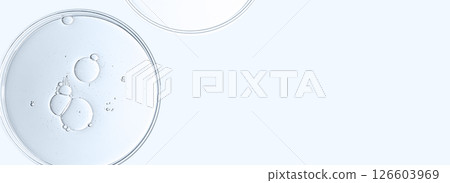 The texture of a cosmetic serum or body gel in a Petri dish. The texture of a cosmetic serum or body gel in a Petri dish. 126603969