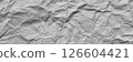 A textured light gray crumpled paper background with natural creases and folds. Ideal for design projects, digital graphics, or creative presentations requiring a vibrant, Long banner 126604421