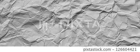 A textured light gray crumpled paper background with natural creases and folds. Ideal for design projects, digital graphics, or creative presentations requiring a vibrant, Long banner 126604421