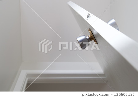 White interior door with round metal handle 126605155