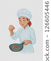 a young chef is cooking 126605446