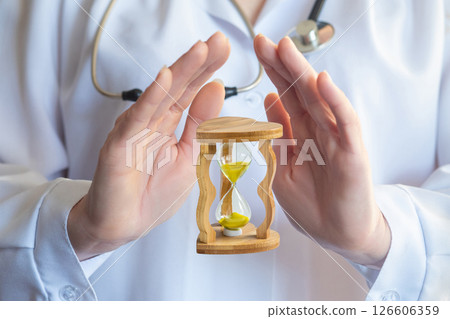 Time protected by the hands of a physician. 126606359