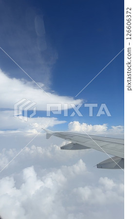 vertical photos Airplane wing clouds Wing of the plane on blue sky background vertical photos Airplane wing clouds Wing of the plane on blue sky background 126606372