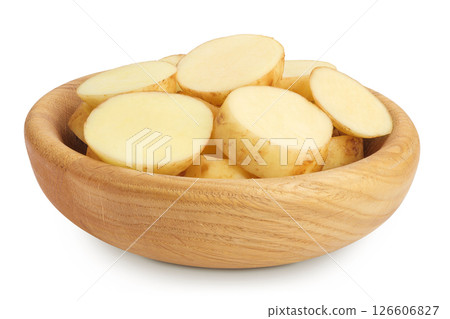 young potato slices in a wooden bowl isolated on white background. Harvest new young potato slices in a wooden bowl isolated on white background. Harvest new 126606827