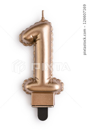 Golden cake candle in shape of number one Golden cake candle in shape of number one 126607169