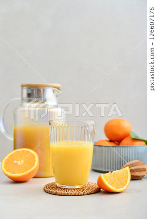 Orange fresh squeezed juice in glass and glasses jug 126607178