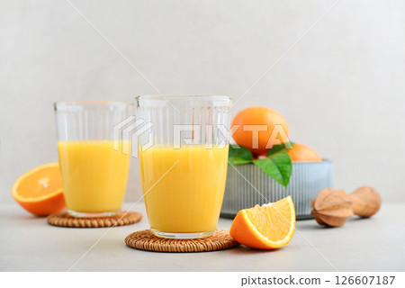 Orange fresh squeezed juice in glass and glasses jug Orange fresh squeezed juice in glass and glasses jug 126607187