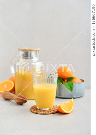 Orange fresh squeezed juice in glass and glasses jug 126607190