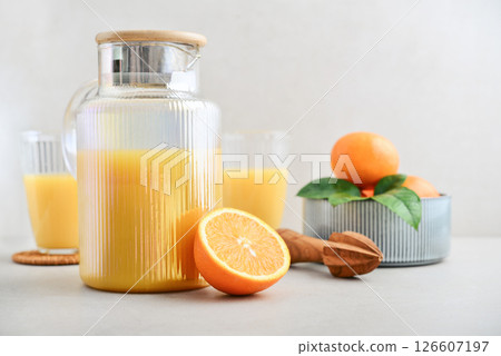 Orange fresh squeezed juice in glass and glasses jug Orange fresh squeezed juice in glass and glasses jug 126607197
