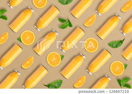 Pattern from bottles of orange juice and orange slices Pattern from bottles of orange juice and orange slices 126607210