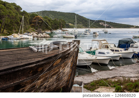 Old wooden boat in the harbour of Primosten, village in the Central Dalmatia region, on the Adriatic coast of the Mediterranean Sea, Croatia 126608020