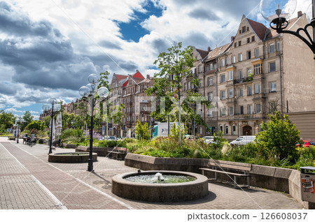 Nuremberg, Germany, August 2, 2023. Beautiful shot with an iconic street image location. Beautiful summer day with blue sky and white clouds. Old houses overlook the street. 126608037