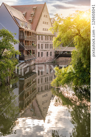 Nuremberg, Germany, August 2, 2023. Beautiful shot with an iconic image of the fairytale atmosphere of the place. On the beautiful summer day the house is reflected in the water. 126608041
