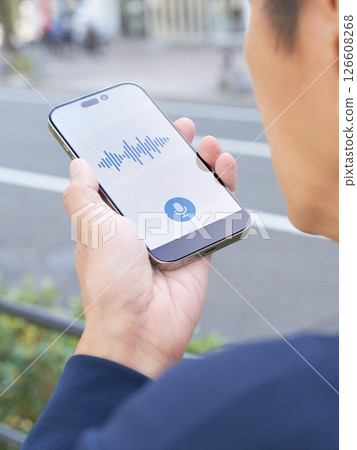 The hands of a business person using a voice input app The hands of a business person using a voice input app 126608268