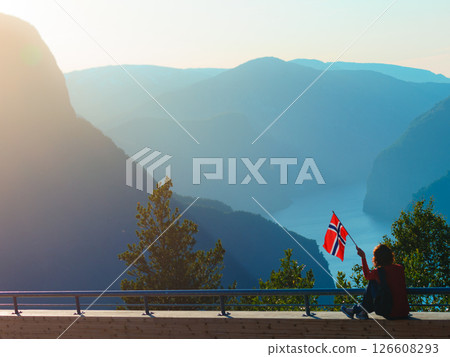 Tourist enjoy fjord view on Stegastein viewpoint Norway 126608293