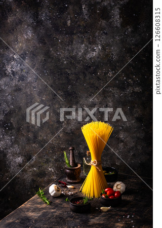 Italian food background with spaghetti, tomato and spices 126608315