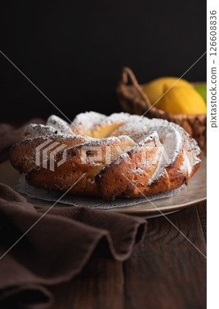 Lemon bundt cake powdered sugar on wooden table Lemon bundt cake powdered sugar on wooden table 126608836
