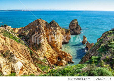 Ponta da Piedade is a unique rock formation with famous grottos in the ocean at Lagos, Algrave, Portugal 126608903