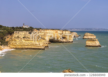 Praia da Marinha Beach among rock islets and cliffs seen from Seven Hanging Valleys Trail, Algarve, Portugal 126608940