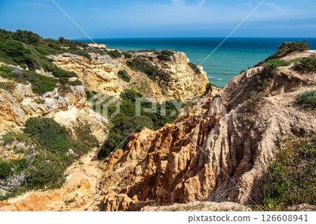 Praia da Marinha Beach among rock islets and cliffs seen from Seven Hanging Valleys Trail, Algarve, Portugal 126608941