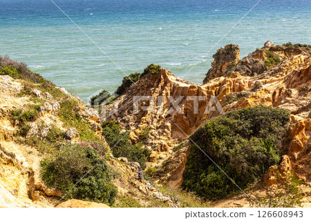 Praia da Marinha Beach among rock islets and cliffs seen from Seven Hanging Valleys Trail, Algarve, Portugal 126608943
