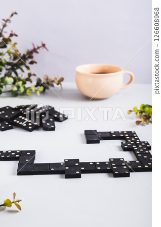 A calm domino board game for leisure on the table vertical view 126608968