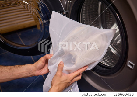 Washing Shoes in a Laundry Bag is an innovative method for efficiently cleaning your footwear 126609436